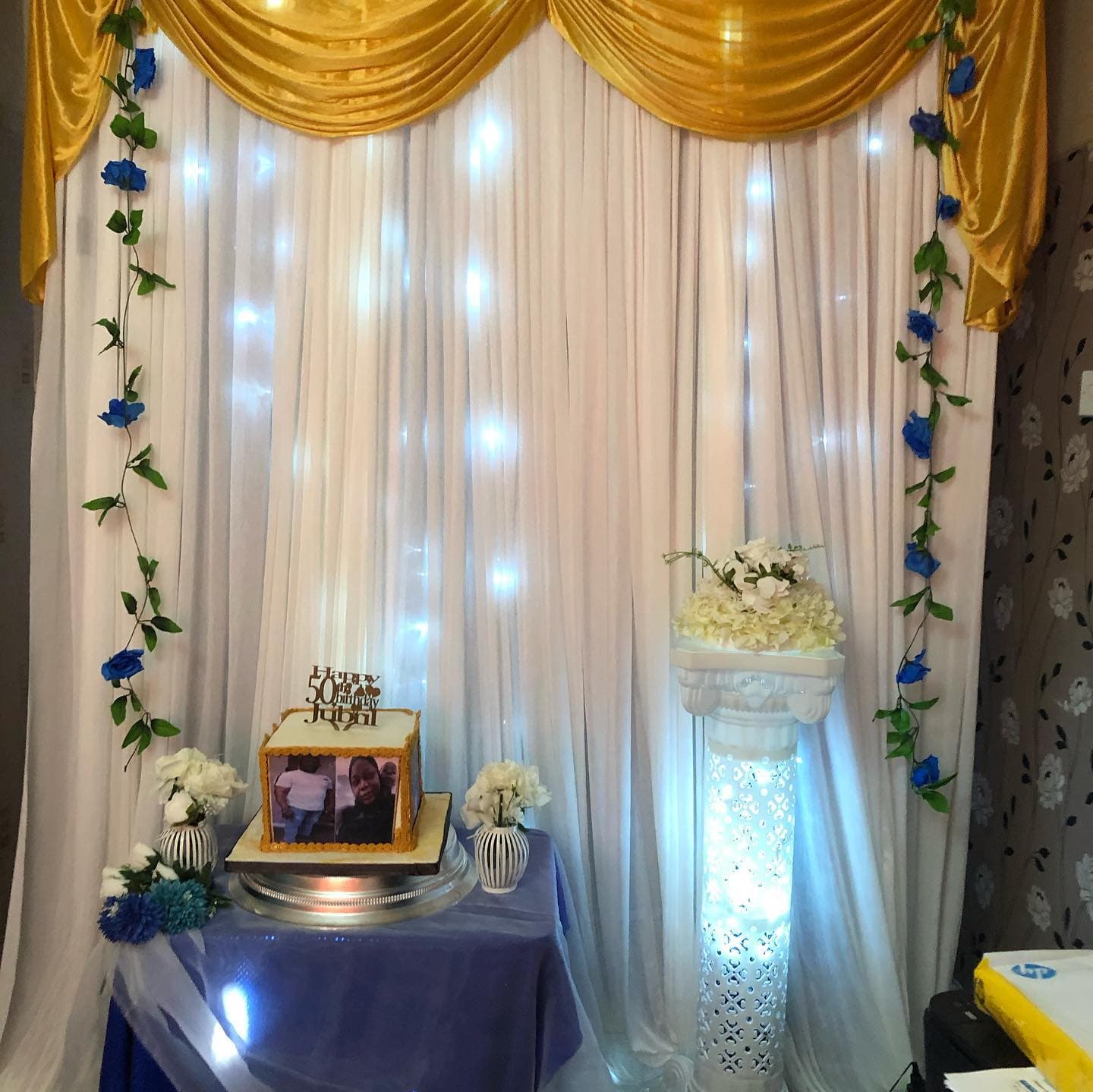 Gold drape and fairy lights